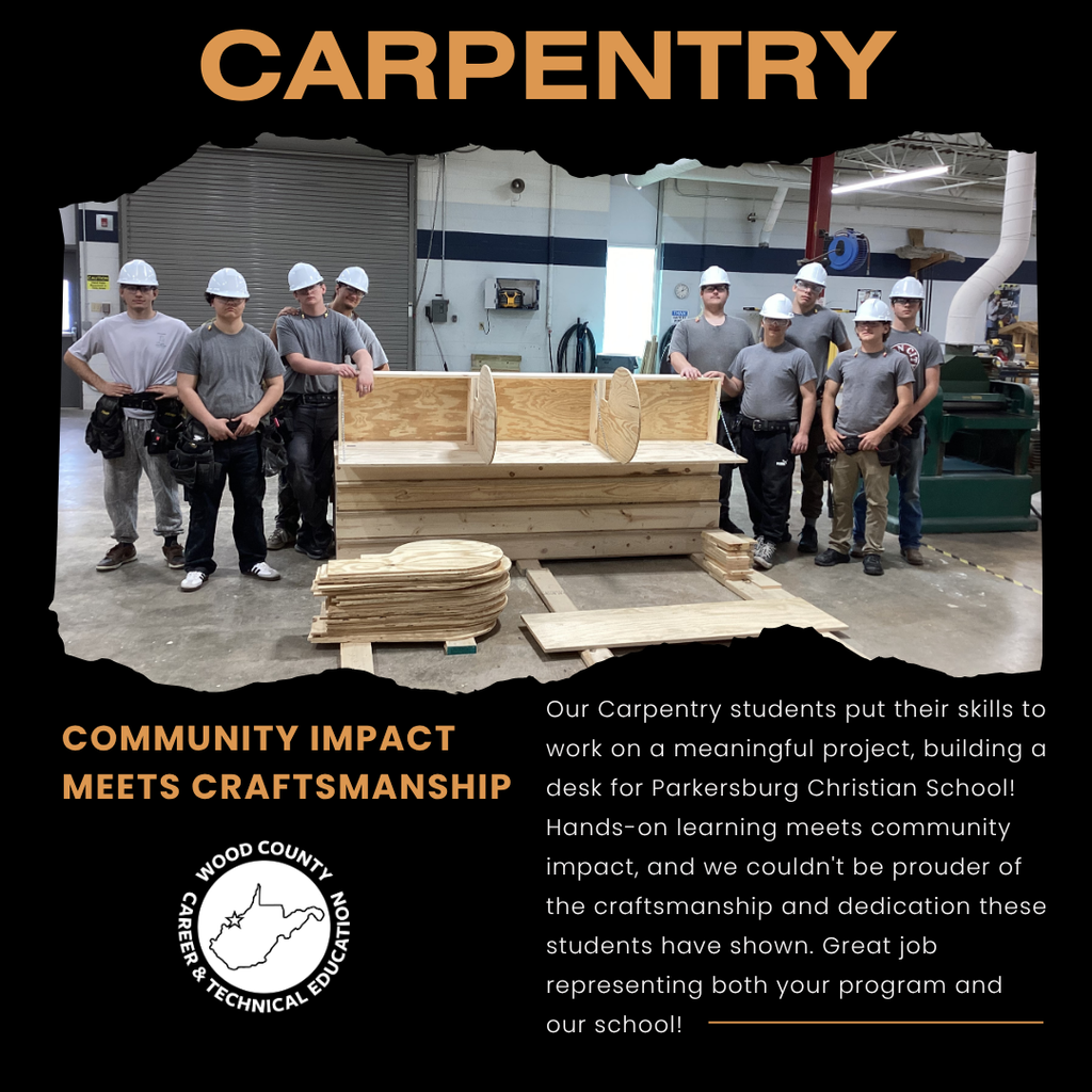 Image shows students standing beside lumber to build desks.
