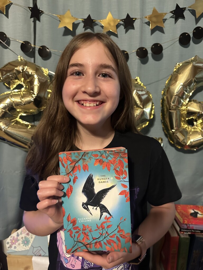 student holding book