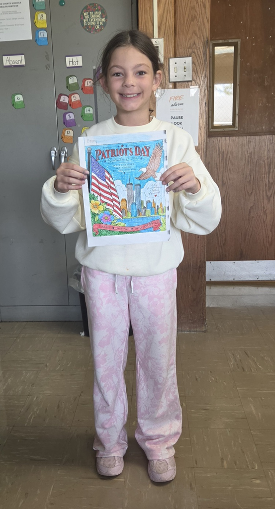 Student holding colored picture for Patriot Day