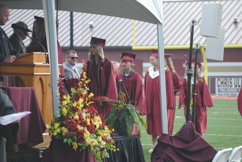 students in line to receive diplomas