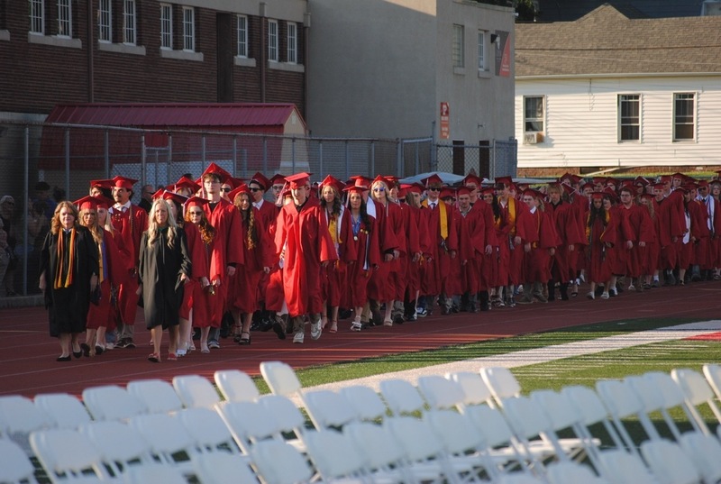 PHS grads filing in