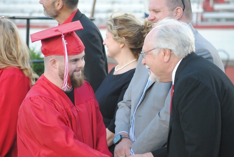 PHS graduate shaking hands