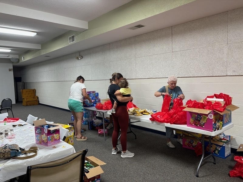 volunteers packing lunches for children