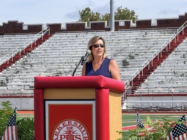 image of a woman standing at a podium
