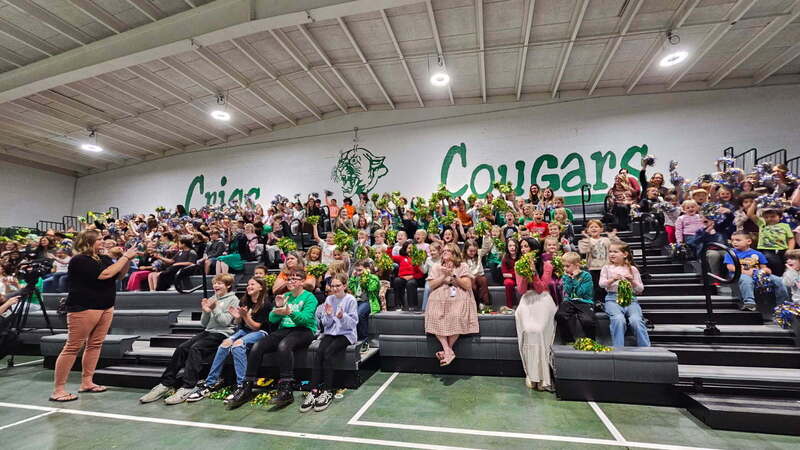 Bleachers full of students and staff