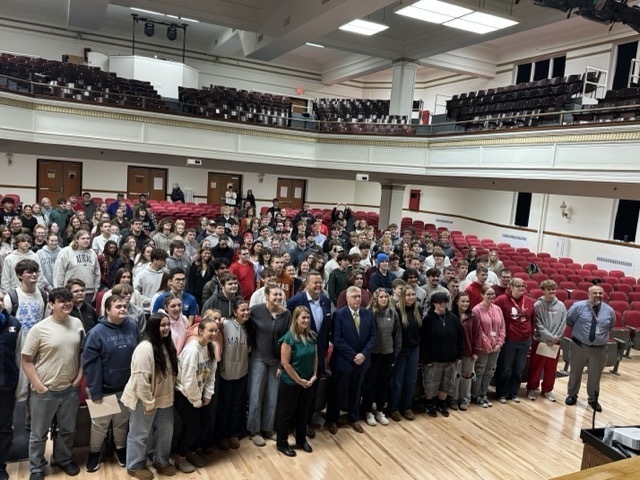 image of voter eligible students at parkersburg high school standing in the school's auditorium