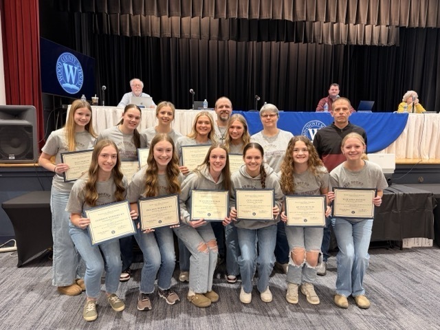 williamstown high school student athletes accepting recognitions letters at the wood county board of education meeting
