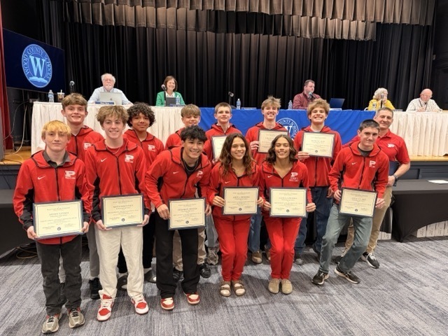 parkersburg high school members of the wrestling team receive a certificate of recognition