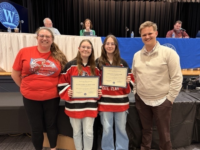 members of the parkersburg high school swim team receive a certificate of recognition