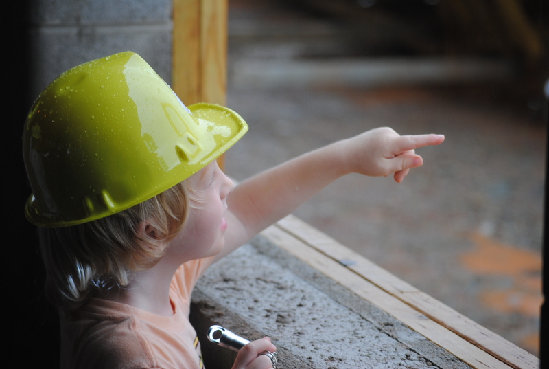 Student pointing to heavy machinery at Lubeck