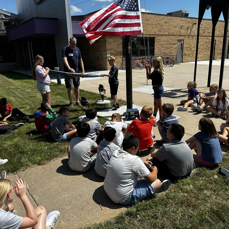 Fifth graders learning about proper flag etiquette