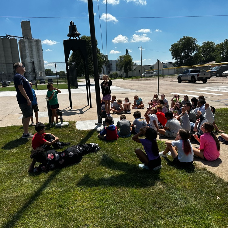 Fifth graders learning about proper flag etiquette