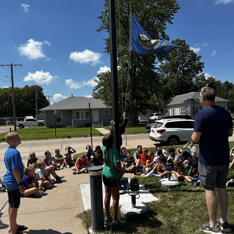 Fifth graders learning about proper flag etiquette