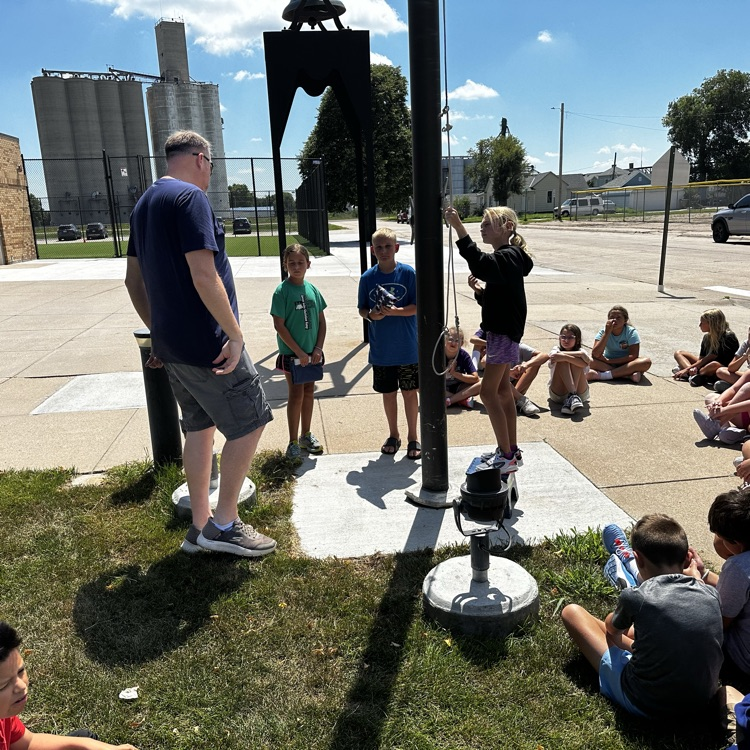 Fifth graders learning about proper flag etiquette