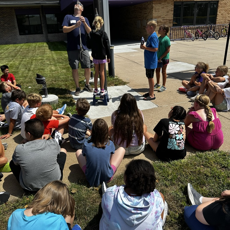 Fifth graders learning about proper flag etiquette