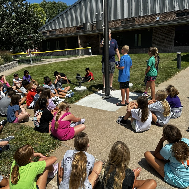 Fifth graders learning about proper flag etiquette