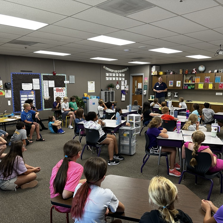 Fifth graders learning about proper flag etiquette