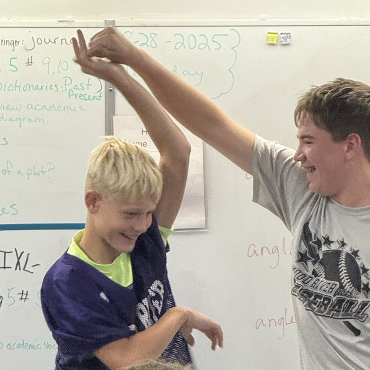 Boys demonstrating verbs