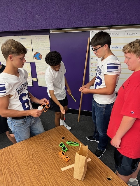 Students buying and selling in the marketplace.