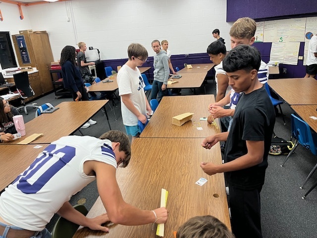 Students buying and selling in the marketplace.