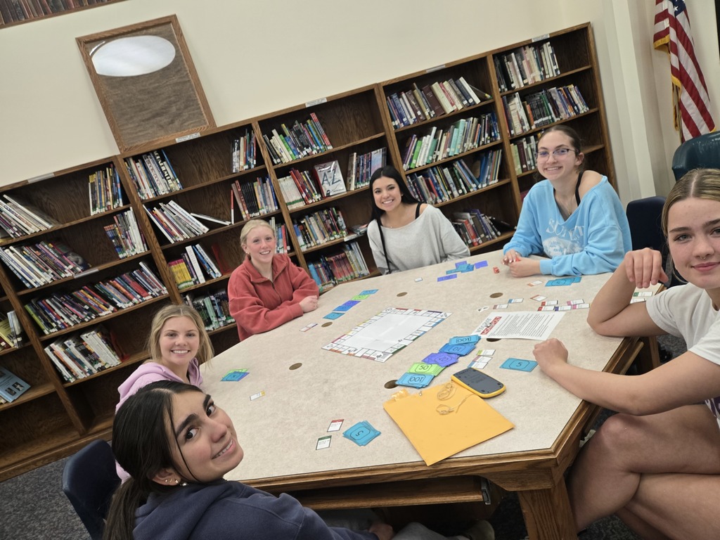 Senior ladies playing Wood River Monopoly