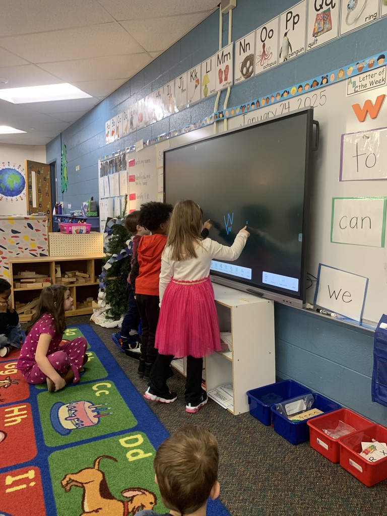 young fives practicing writing letters