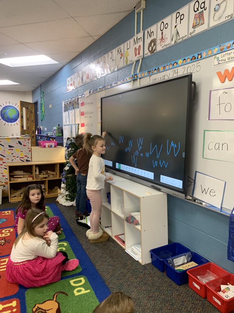 young fives practicing writing letters