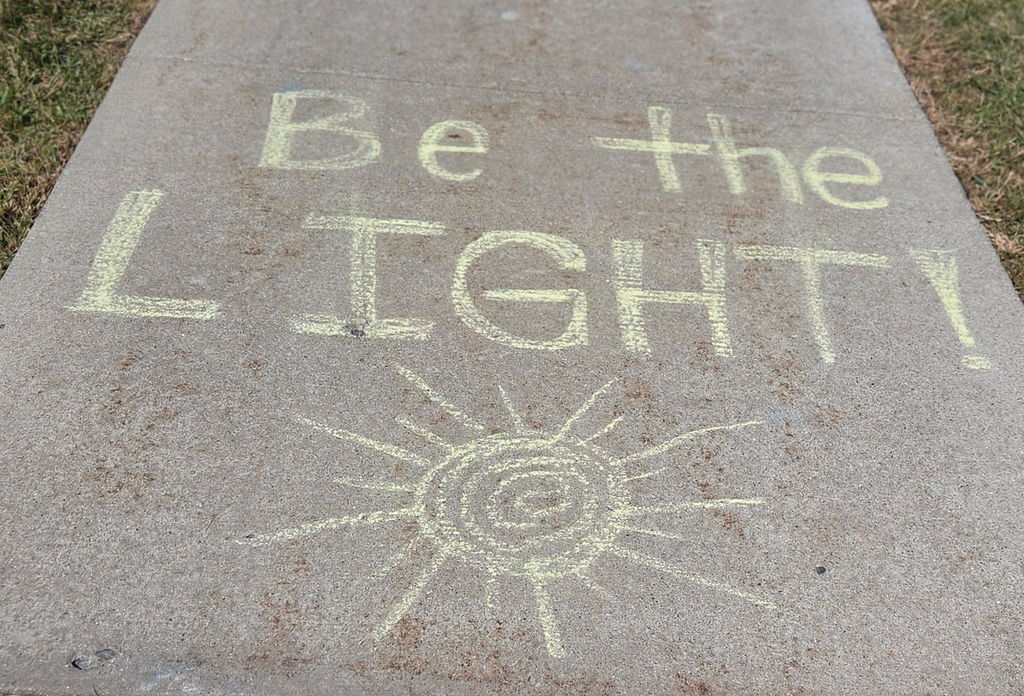 students drawing with sidewalk chalk
