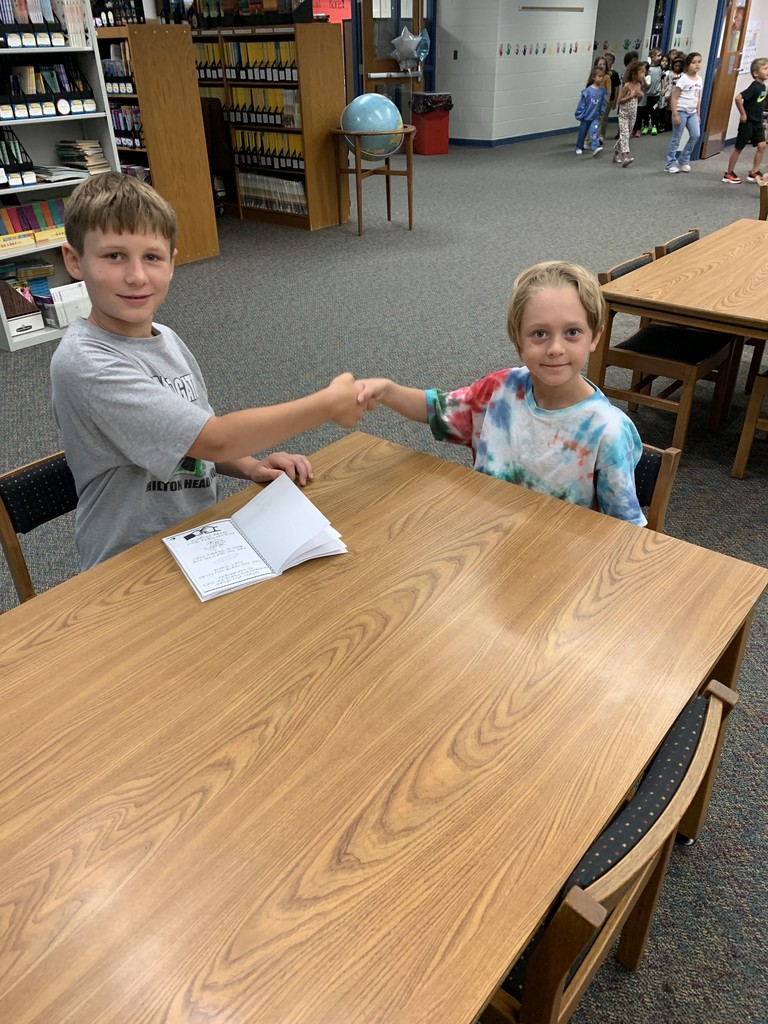 students shaking hands