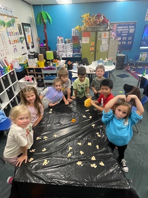 students with pumpkin