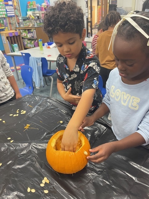 students with pumpkin