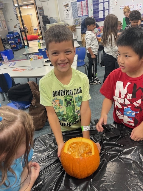 students with pumpkin