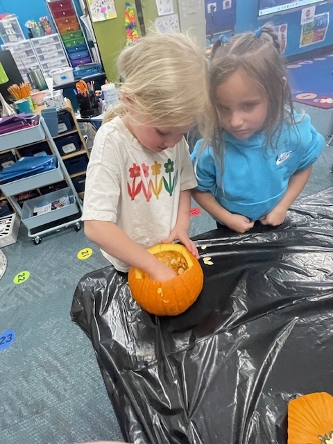 students with pumpkin