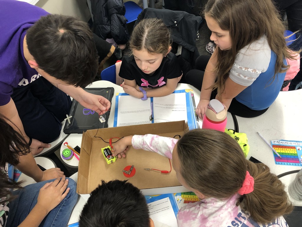 students testing closed circuits