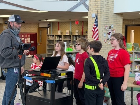 students with man with microphones