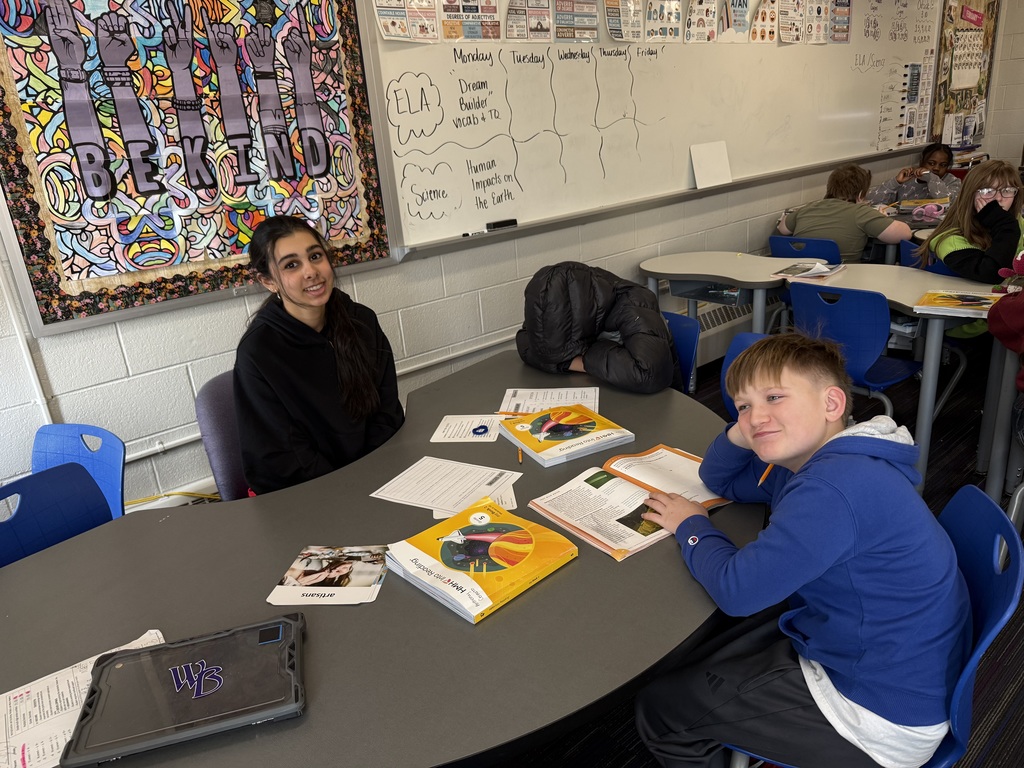students sitting together at table