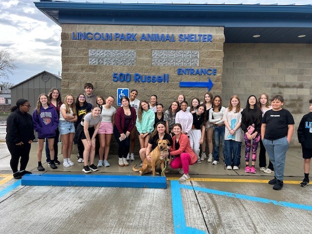 students outside the animal shelter