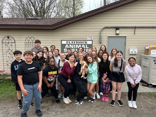 students outside the animal shelter
