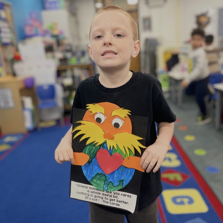 student holding lorax