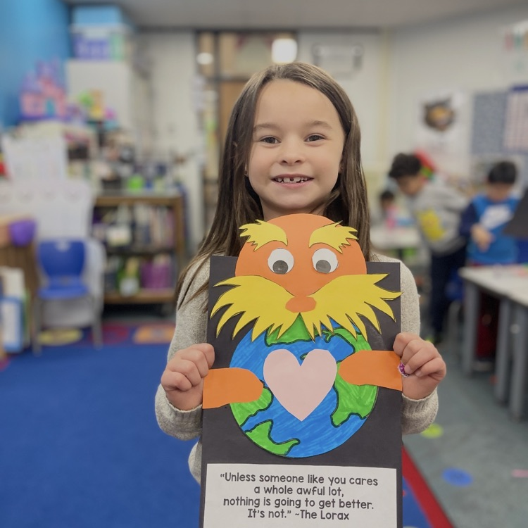 student holding lorax