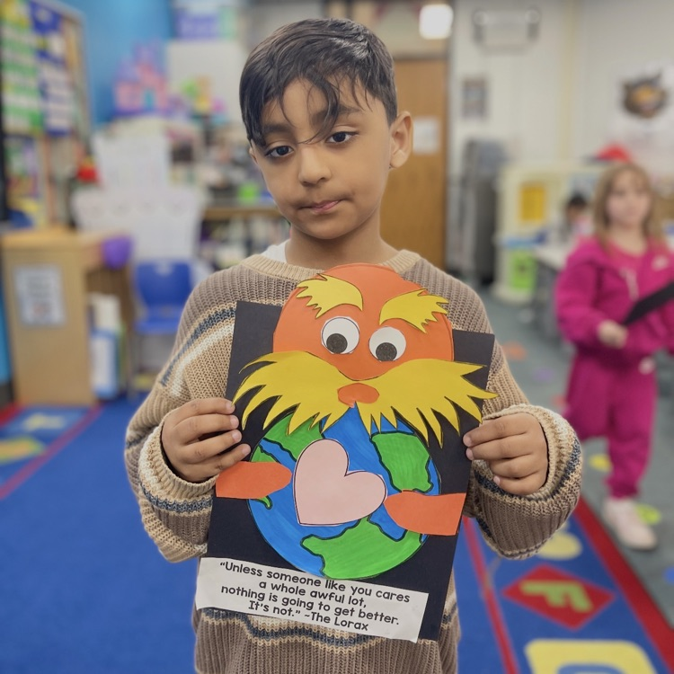 student holding lorax
