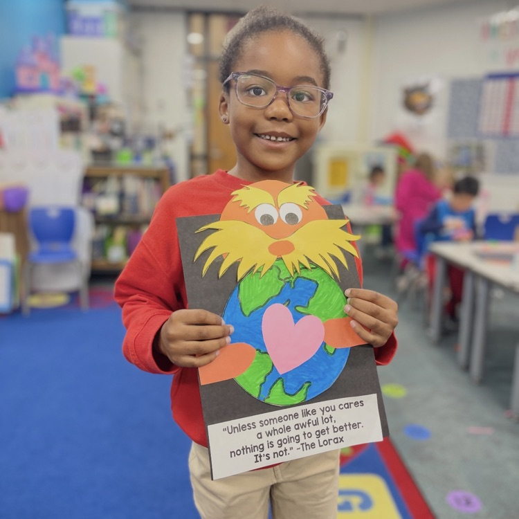 student holding lorax