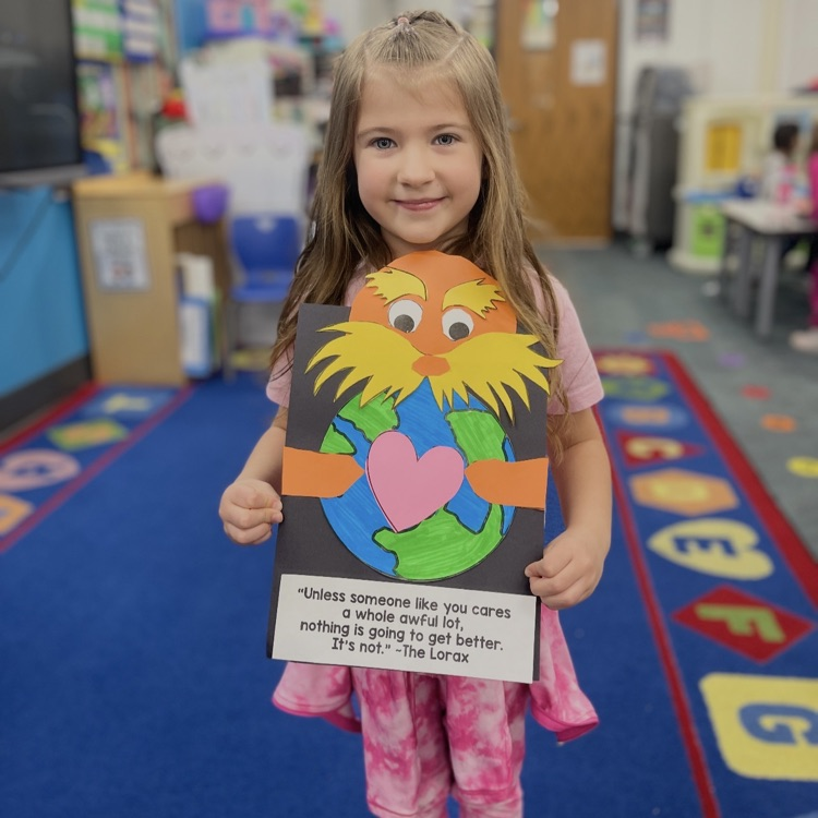 student holding lorax