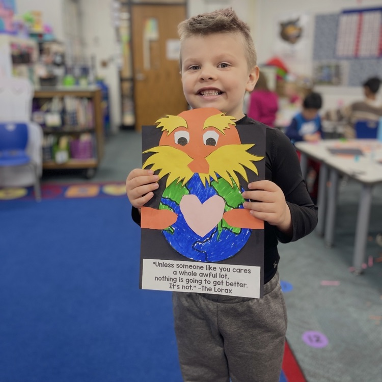 student holding lorax