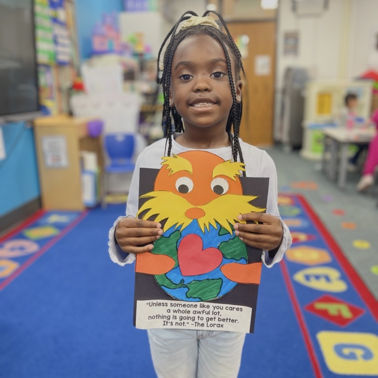 student holding lorax