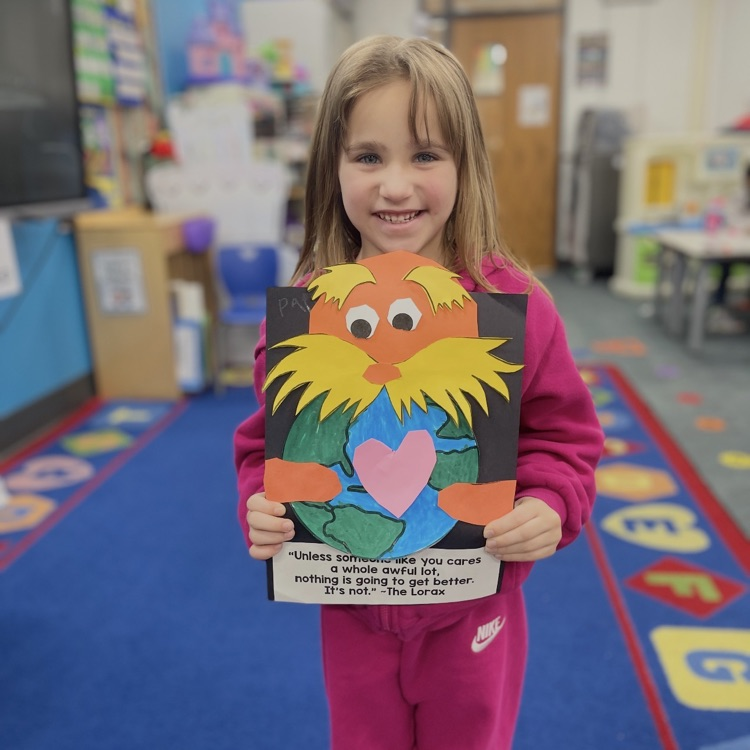 student holding lorax