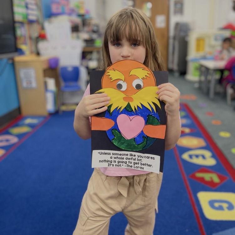 student holding lorax