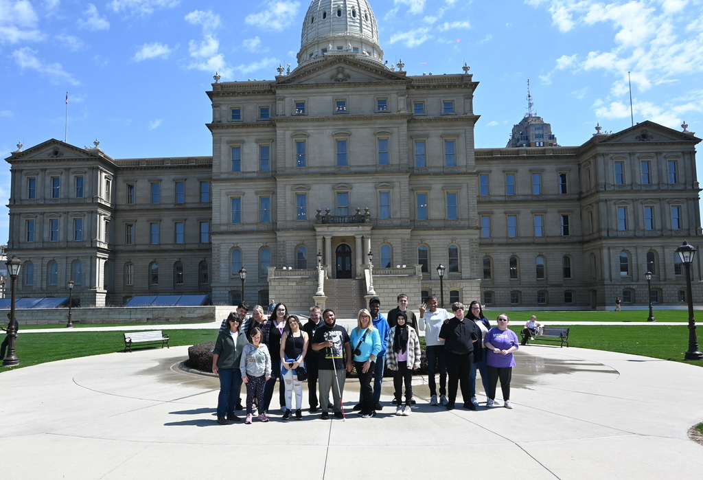 students and teachers outside of the michigan capital building