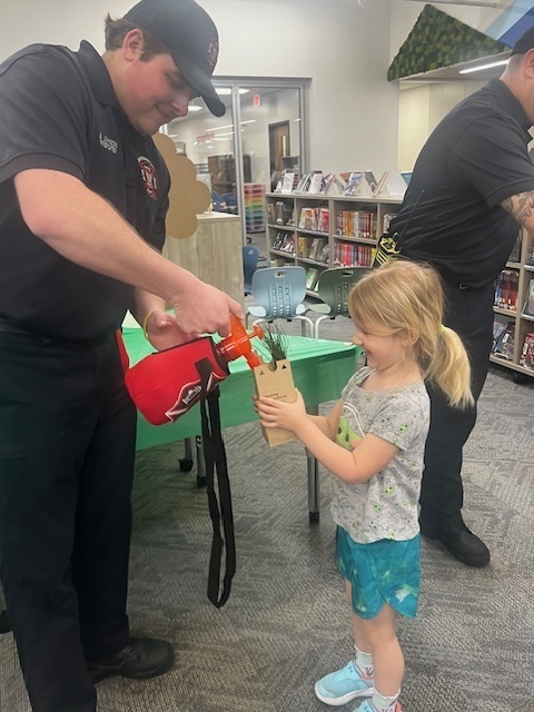 firefighters spraying water on a tree