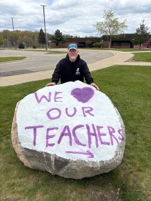 BMS principal Drew clark with a painted rock